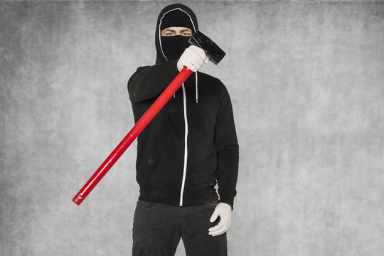 A Masked Stranger Shows An Action Tool