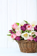 Bouquet of tulips on a wall paneling background