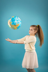 Concept - education. Caucasian girl holding a globe