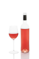 Rose wine bottle with filled wineglass, isolated on white with clipping path