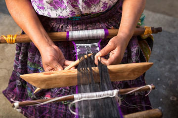 San Pedro la Laguna, Guatemala: hand of a Mayan woman making a traditional belt