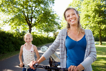 Mother and daughter with bike
