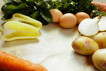 Russian traditional soup ingredients: sorrel, parsley, potatoes, carrots, garlic, egg, onion and pepper