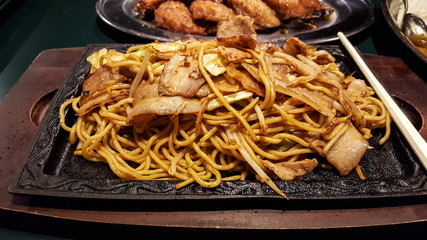 Yakisoba-Japanese dish of fried noodles, vegetables and bacon.Japanese food.
