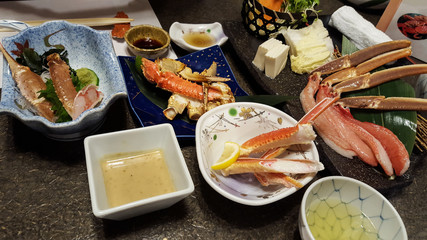 grilled crab and fresh king crab legs with vegetables on dish.Shabu-shabu Japanese food. Shabu-shabu is a Japanese nabemono hotpot dish of thinly sliced meat and vegetables boiled in water.