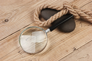 magnifying glass and rope