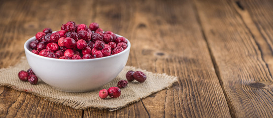 Some fresh Dried Cranberries (selective focus; close-up shot)