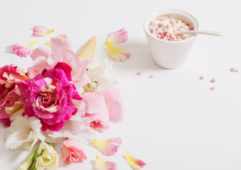 flowers in waffle cone on wooden background