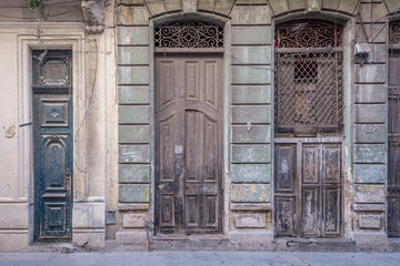 Three tall old vintage hispanic doors at Havana, Cuba