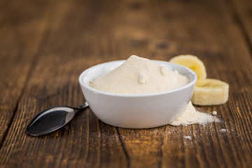Ground Banana on wooden background; selective focus