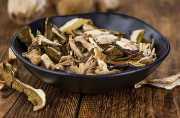 Dried Porcinis on vintage wooden background