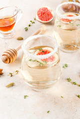 Fall cold sweet white wine cocktail with fig, plum, honey and thyme, copy space