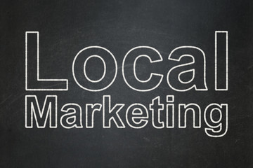 Obraz premium Advertising concept: Local Marketing on chalkboard background
