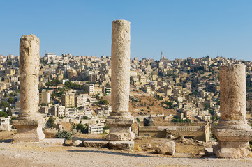Ancient stone columns at the Citadel of Amman with the blue sky at the background in Amman, Jordan.