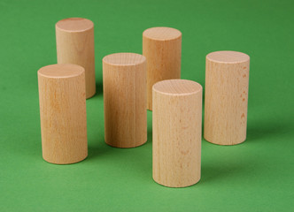 wooden geometric shapes on a green background