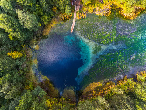 Aerial view of the karst lake named Goluboye Ozero (Blue Lake) surrounded by forest. Maximum depth is 18m (60ft). Lake is situated near the city of Kazan, Russia