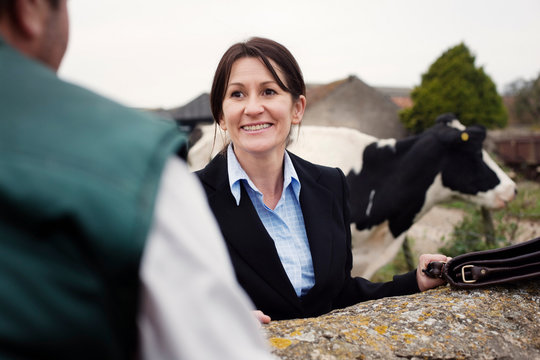 Business Woman Talking To Farmer