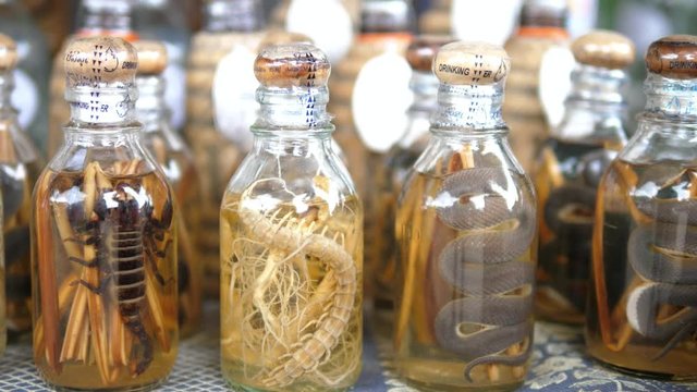 Closeup Whiskey With Snakes, Centipedes and Scorpions In Laos. HD, 1920x1080.