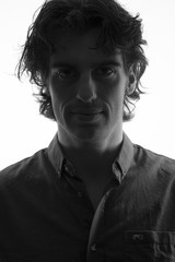 Standard portrait of young anonymous man with backlighting