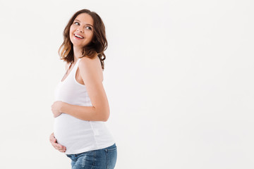 Pregnant woman standing isolated