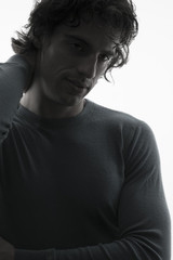 Portrait of young anonymous man with backlighting