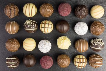 background of different chocolate truffles
