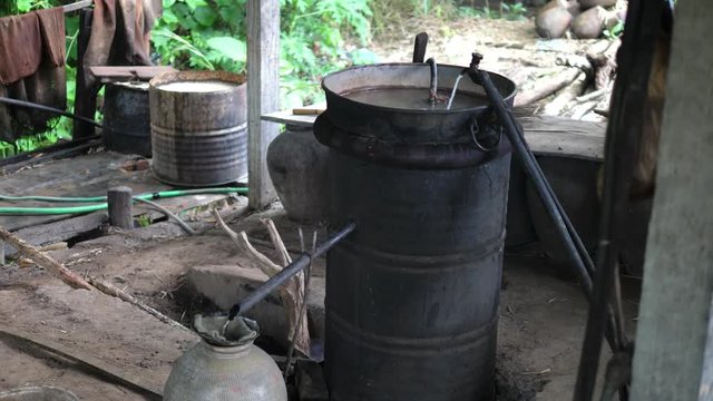Moonshine Still in Action at Home Alcohol Machine In Laos. HD, 1920x1080. 