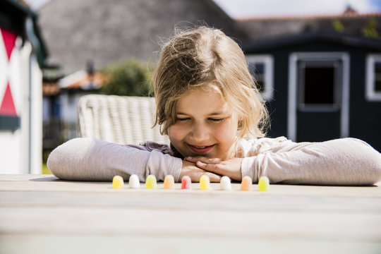 Girl looking at sweets on table