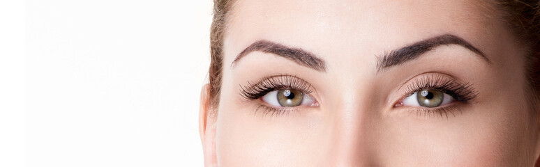 Closeup shot of woman eye with day makeup. Long eyelashes