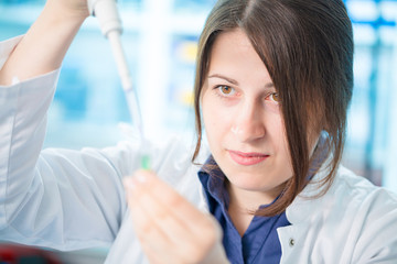 young woman lab assistant in a genetics lab