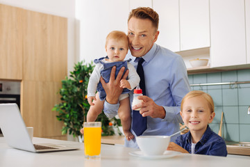 Delighted happy family looking at you