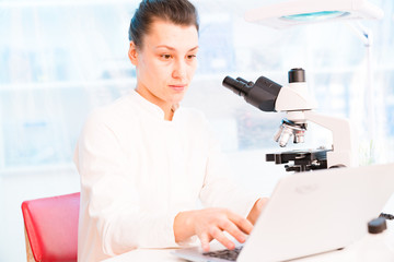 Young female technician in the laboratory of food quality control