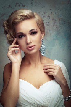 Beautiful bride with fashion wedding hairstyle - close up pictur