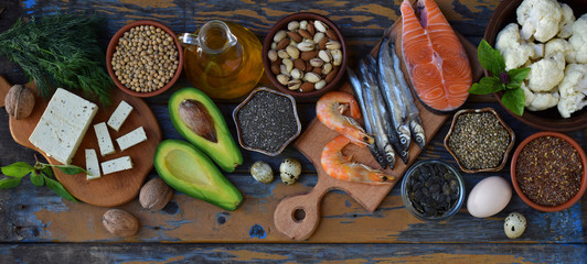 Composition of products containing unsaturated fatty acids Omega 3 - fish, nuts, tofu, avocado, egg, soybeans, flax, pumpkin seeds, chia, hemp, cauliflower, dill, vegetable oil. Top view. Healthy food - obrazy, fototapety, plakaty