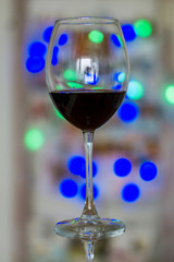close up, red wine glass on a bokeh background