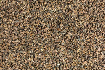 background of crushed organic cocoa nibs