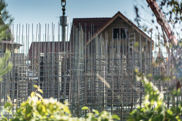 Reinforcement of concrete work. Using steel wire for securing steel bars with wire rod for reinforcement of concrete or cement. focus to steel wire