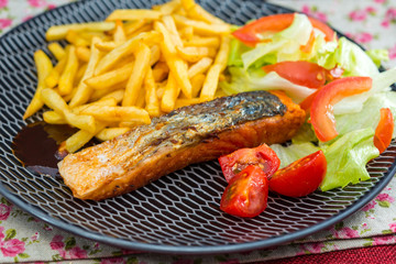 french cuisine dish with tomato and salmon
