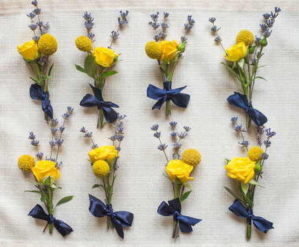 Closeup View Of Floral Decor For Wedding Ceremony And Celebration. Beautiful Several Small Corsages Made Of White, Yellow, Green And Blue Flowers. Flatlay Color Photography.