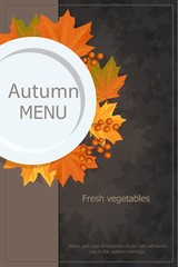 Autumn menu. Plate with yellow leaves Rowan. On a wooden table.