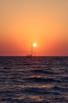 Seascape scenic sunset with a boat.