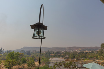 Old lamp with mountain view.