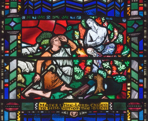 LONDON, GREAT BRITAIN - SEPTEMBER 16, 2017: The stained glass of Moses and the Burning Bush in church St Etheldreda by Charles Blakeman (1953 - 1953).