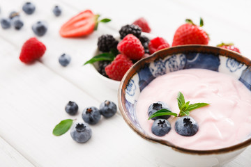 Rich breakfast on white wooden table