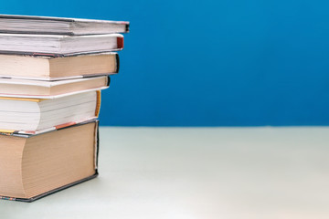 a stack of books of various sizes