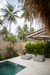 Two bean bags next to the pool