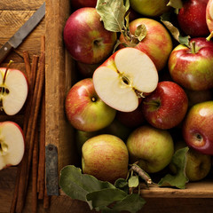 Freshly picked apples in a wooden crate