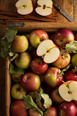 Freshly picked apples in a wooden crate