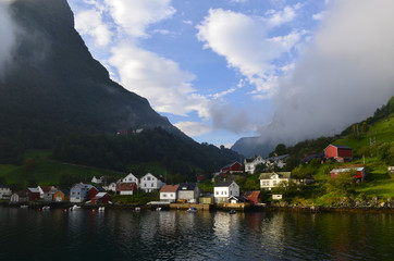 Fototapeta na wymiar Norwegian village on the shore of the fjord