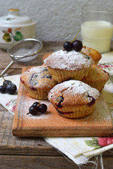 Oat Muffins with black currant on a cutting wooden background. Homemade baking. Healthy food.